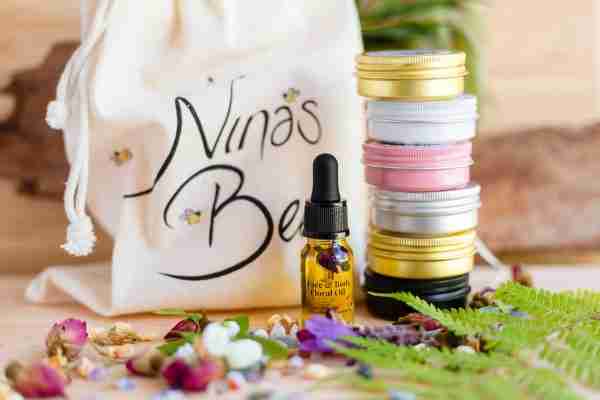 natural skincare starter kit looks like a colourful bundle of mini tins in gold, black, pink and white colours