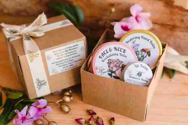 Eco-friendly gift set from Nina's Bees featuring face balm, hand balm, and lip balm in sustainable packaging