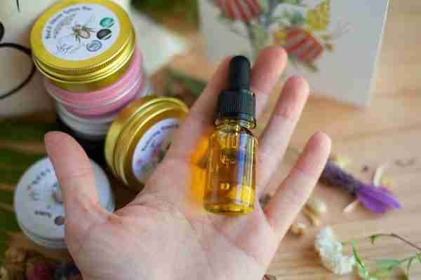 Floral Oil sample size in a palm of a hand
